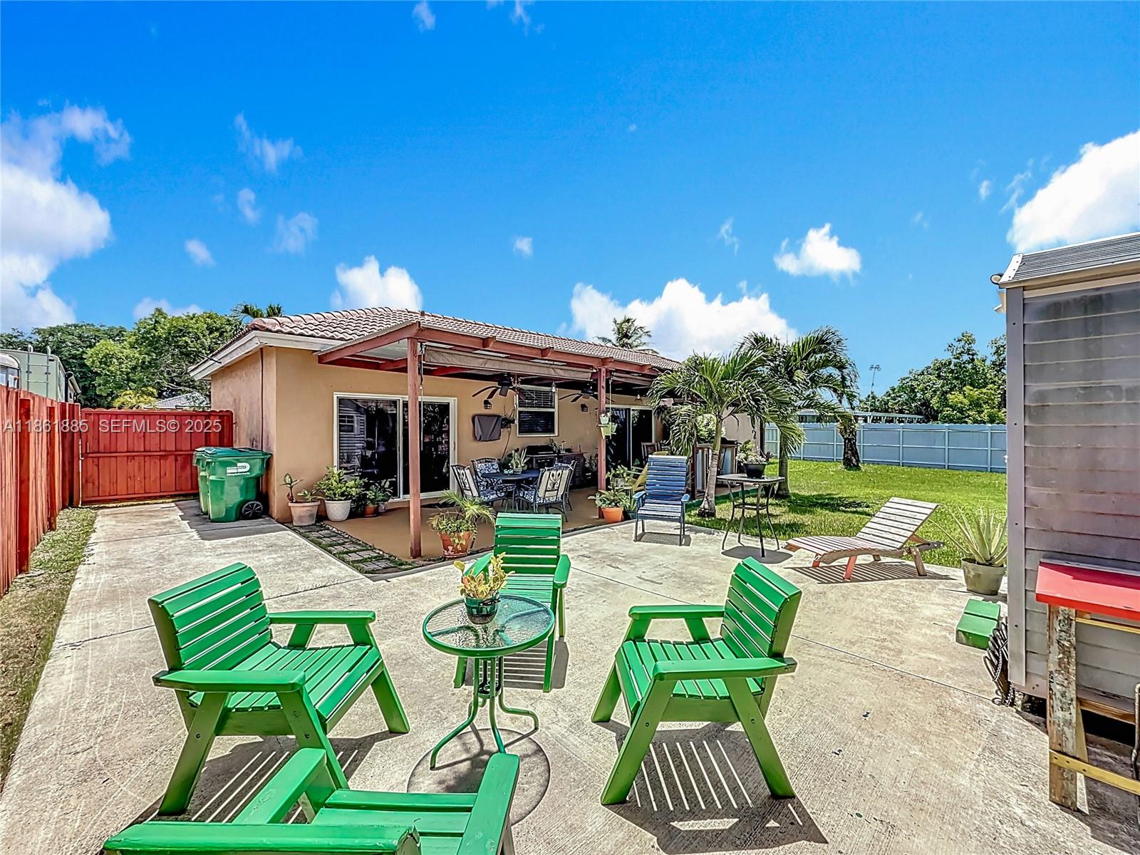 30030 Southwest 154th Avenue Homestead, FL 33033 - Photo 57 of 70 a view of patio with chairs and plants