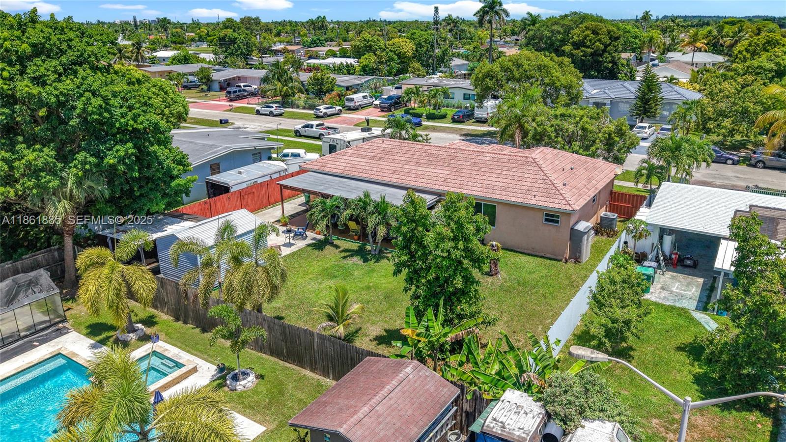 30030 Southwest 154th Avenue Homestead, FL 33033 - Photo 59 of 70 an aerial view of a house with a garden and lake view