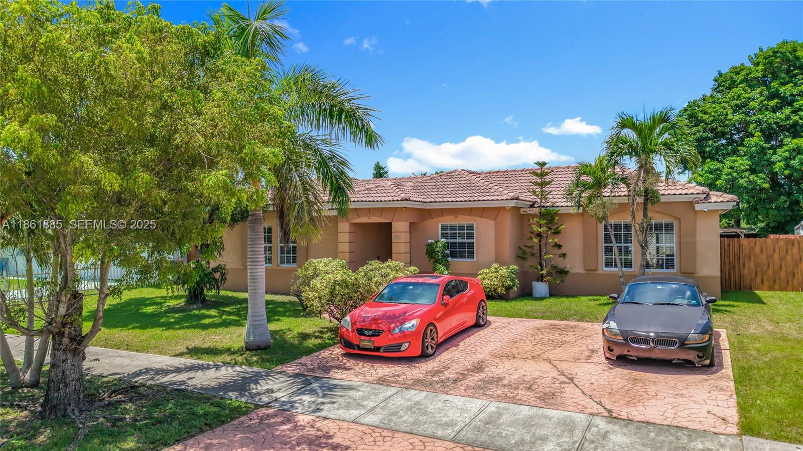30030 Southwest 154th Avenue Homestead, FL 33033 - Photo 6 of 70 a front view of a house with patio