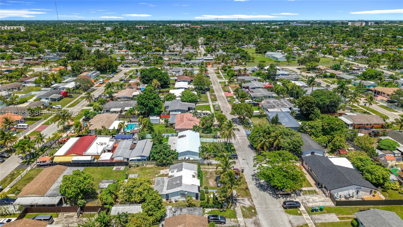 30030 Southwest 154th Avenue Homestead, FL 33033 - Photo 62 of 70 an aerial view of residential houses with outdoor space and trees