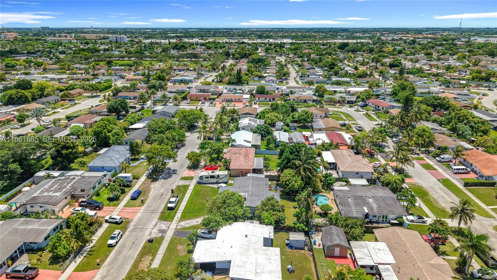 30030 Southwest 154th Avenue Homestead, FL 33033 - Photo 63 of 70 an aerial view of residential houses with outdoor space and trees