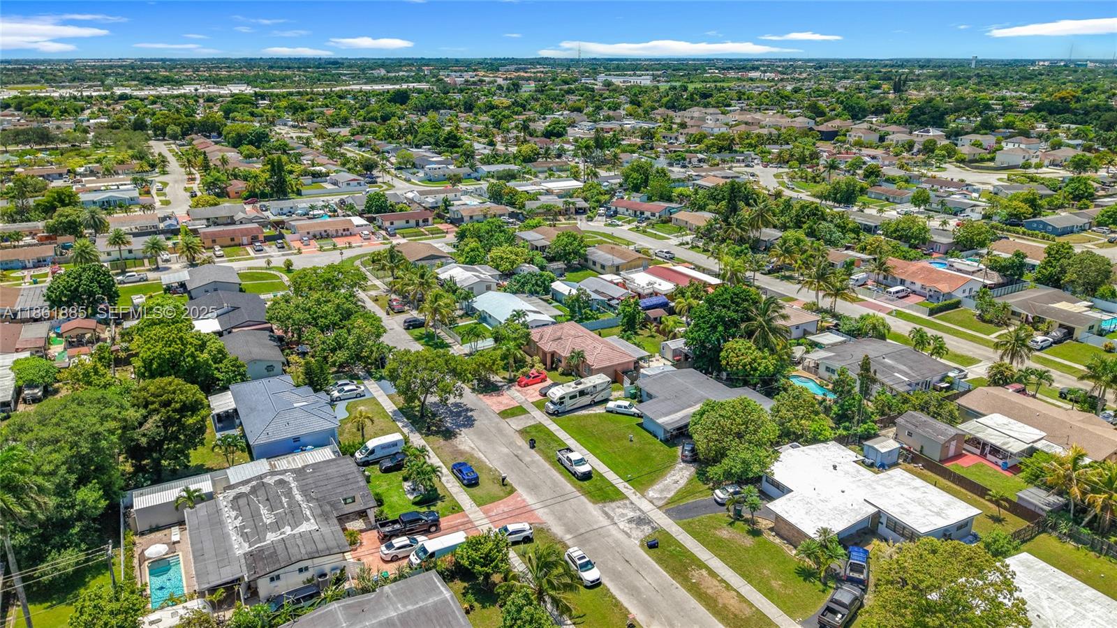 30030 Southwest 154th Avenue Homestead, FL 33033 - Photo 69 of 70 an aerial view of residential houses with outdoor space and trees