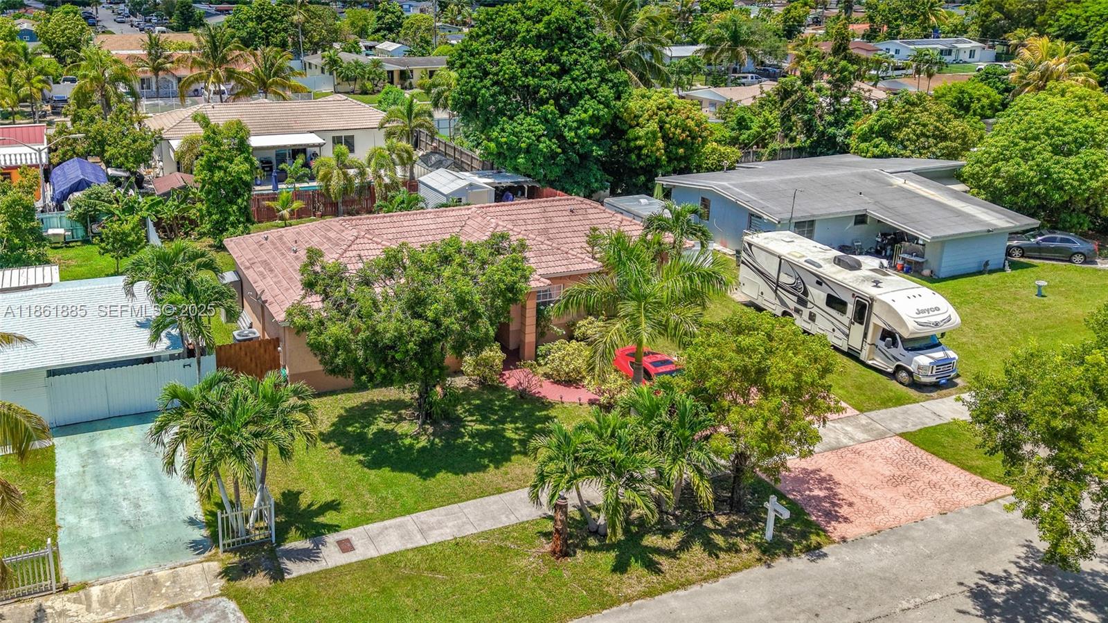 30030 Southwest 154th Avenue Homestead, FL 33033 - Photo 8 of 70 an aerial view of a house with yard swimming pool and outdoor seating