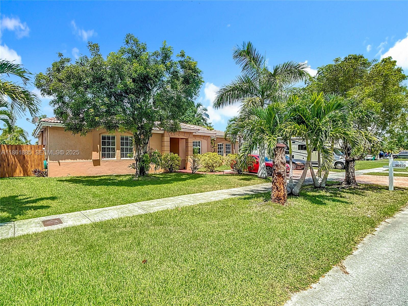 30030 Southwest 154th Avenue Homestead, FL 33033 - Photo 9 of 70 a view of a house with a back yard