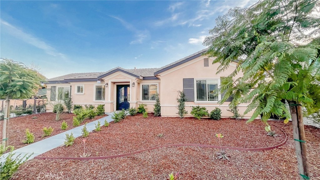11646 Lower Azusa Road El Monte, CA 91732 - Photo 1 of 1 a front view of a house with a yard and potted plants