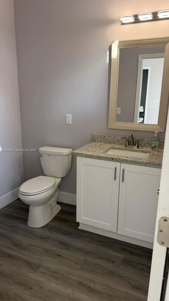 6805 Heavitree Drive Sebring, FL 33876 - Photo 18 of 61 a white toilet sitting next to a bathroom sink