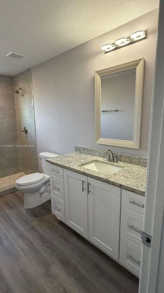 6805 Heavitree Drive Sebring, FL 33876 - Photo 31 of 61 a bathroom with a granite countertop sink mirror and toilet