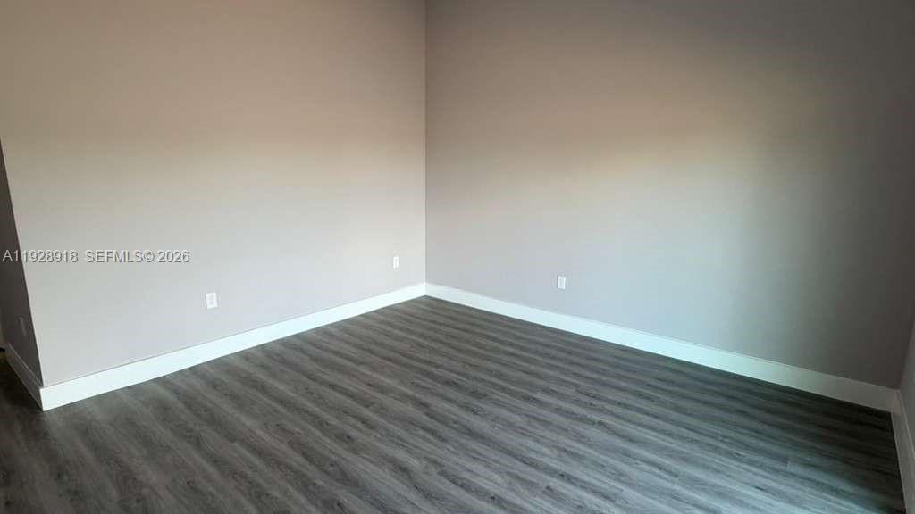 6805 Heavitree Drive Sebring, FL 33876 - Photo 42 of 61 a view of an empty room with wooden floor