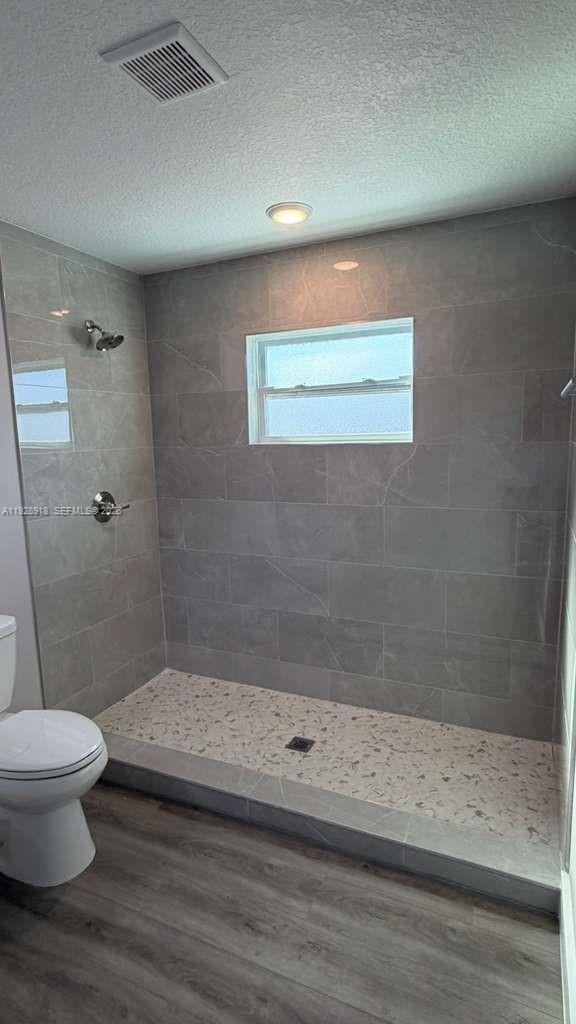 6805 Heavitree Drive Sebring, FL 33876 - Photo 45 of 61 a bathroom with a toilet and a shower