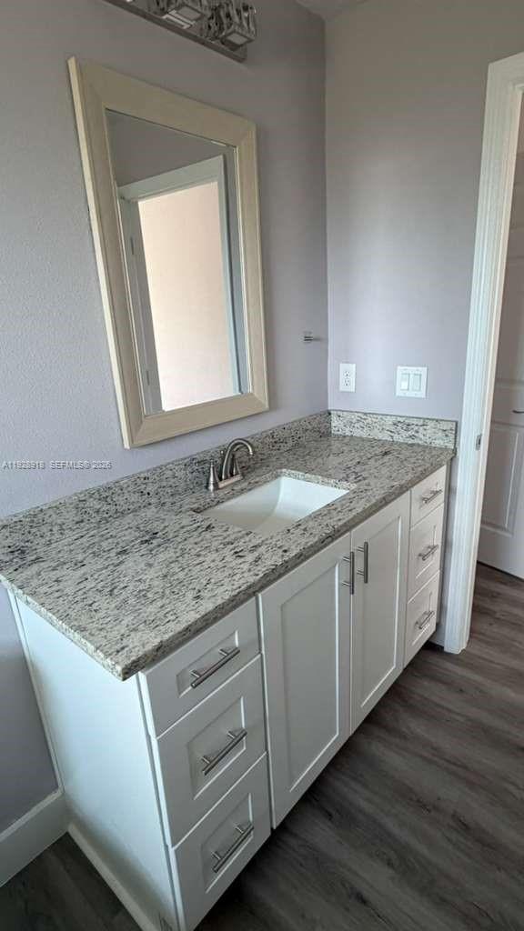6805 Heavitree Drive Sebring, FL 33876 - Photo 50 of 61 a bathroom with a granite countertop sink and a mirror