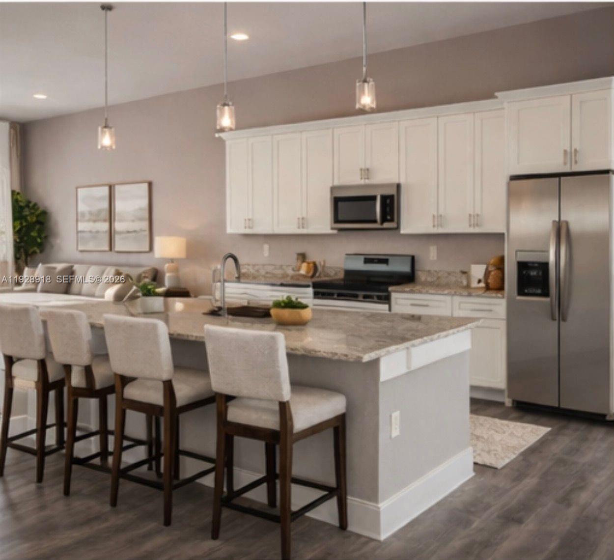 6805 Heavitree Drive Sebring, FL 33876 - Photo 5 of 61 a kitchen with stainless steel appliances granite countertop a table chairs sink refrigerator and microwave