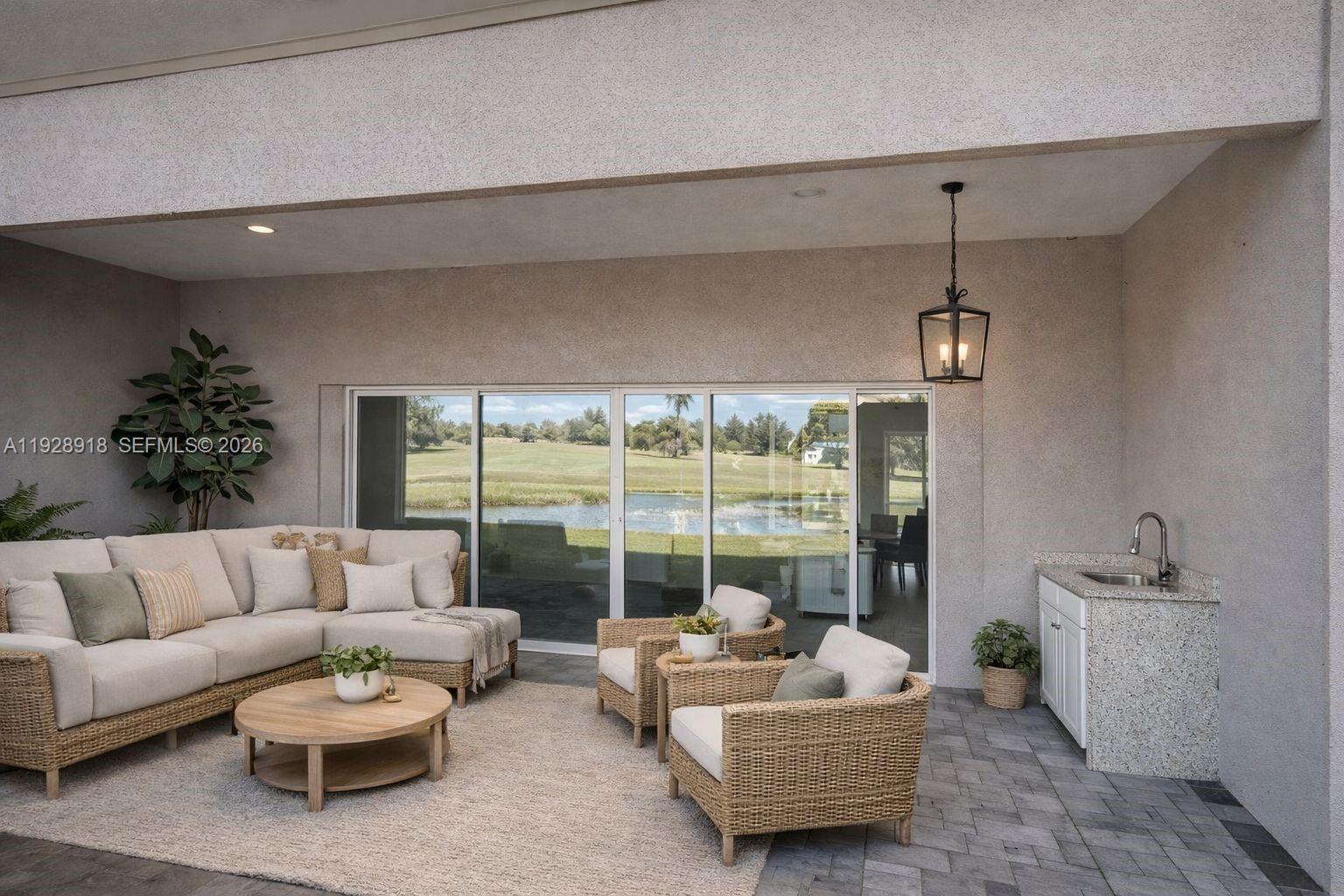 6805 Heavitree Drive Sebring, FL 33876 - Photo 57 of 61 a living room with furniture and a large window