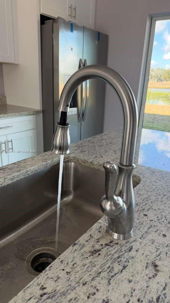 6805 Heavitree Drive Sebring, FL 33876 - Photo 9 of 61 a view of a living room with a sink
