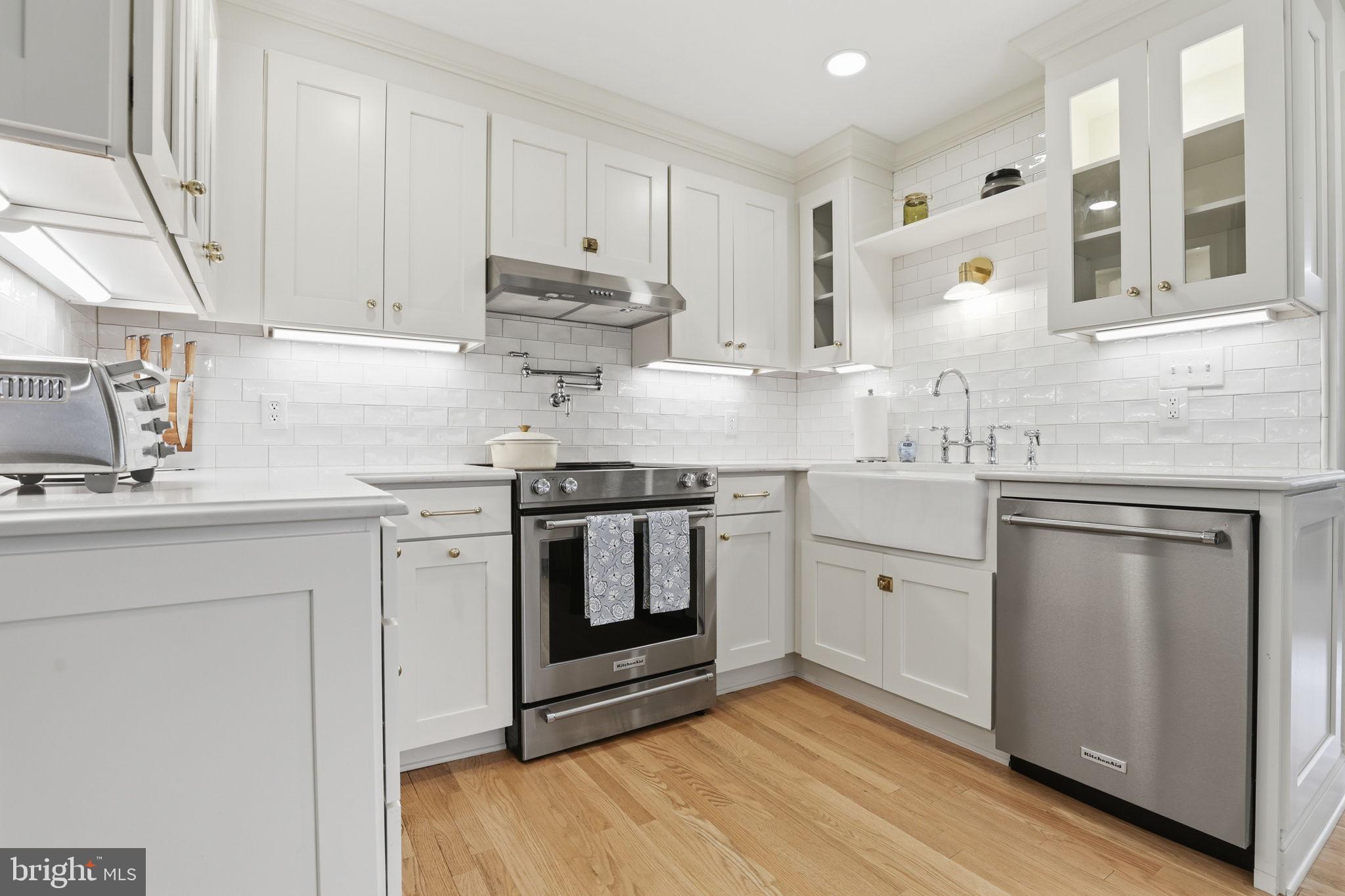 443 Schley Road Annapolis, MD 21401 - Photo 8 of 39 Quartz countertops and designer tile backsplash
