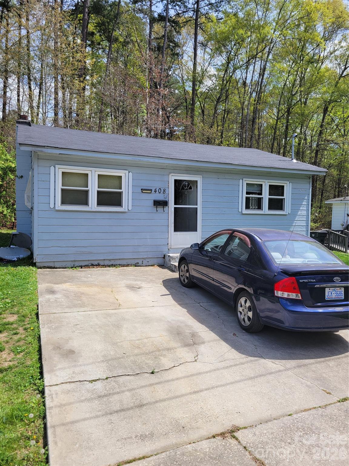 a car parked in front of a house