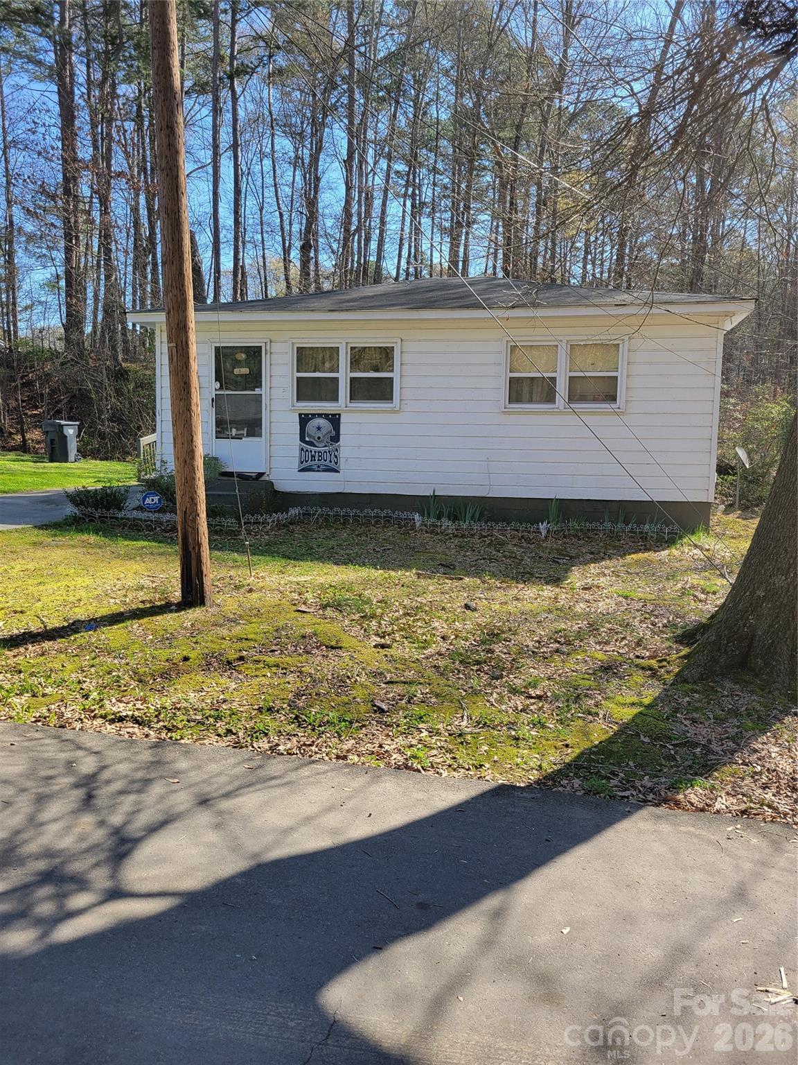 408 South Starr Street Dallas, NC 28034 - Photo 2 of 5 a view of a house with swimming pool next to a yard
