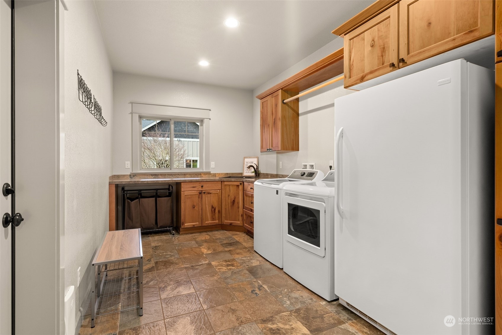 9336 James Road Southwest Rochester, WA 98579 - Photo 24 of 40 a view of kitchen with sink cabinets and window