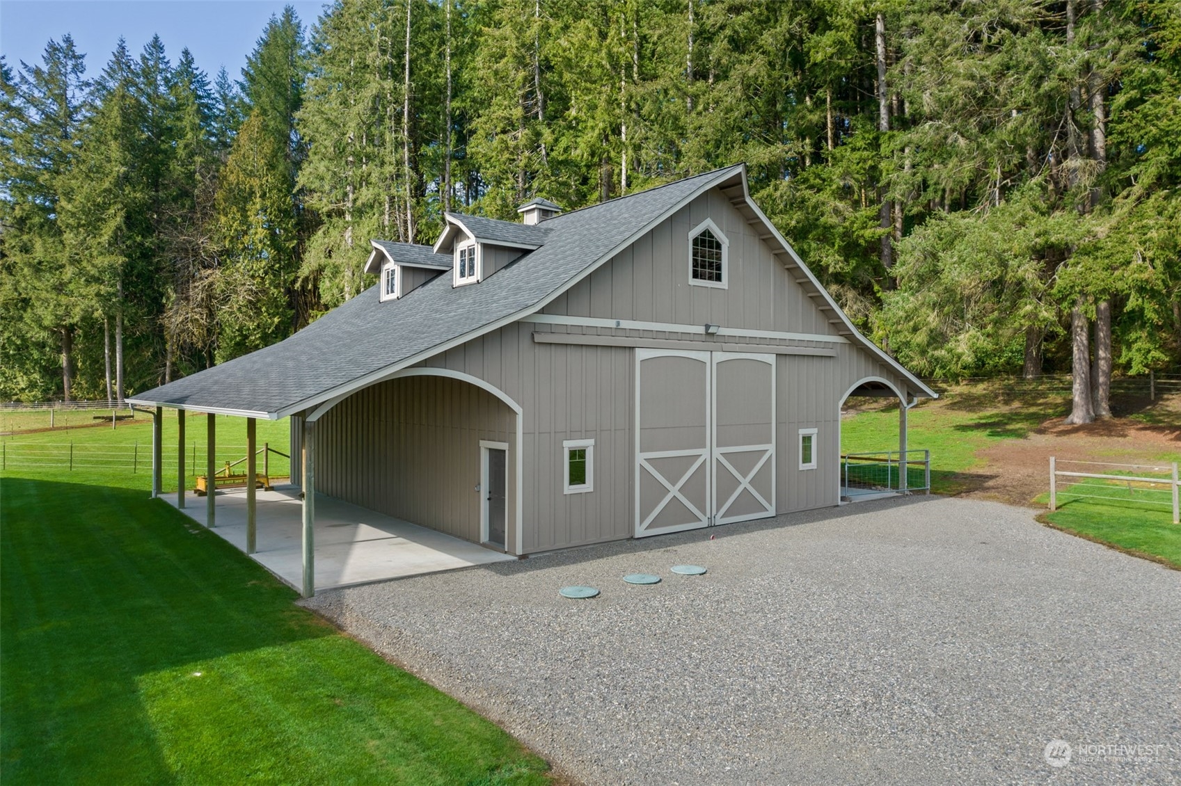 9336 James Road Southwest Rochester, WA 98579 - Photo 36 of 40 a front view of a house with a yard and garage