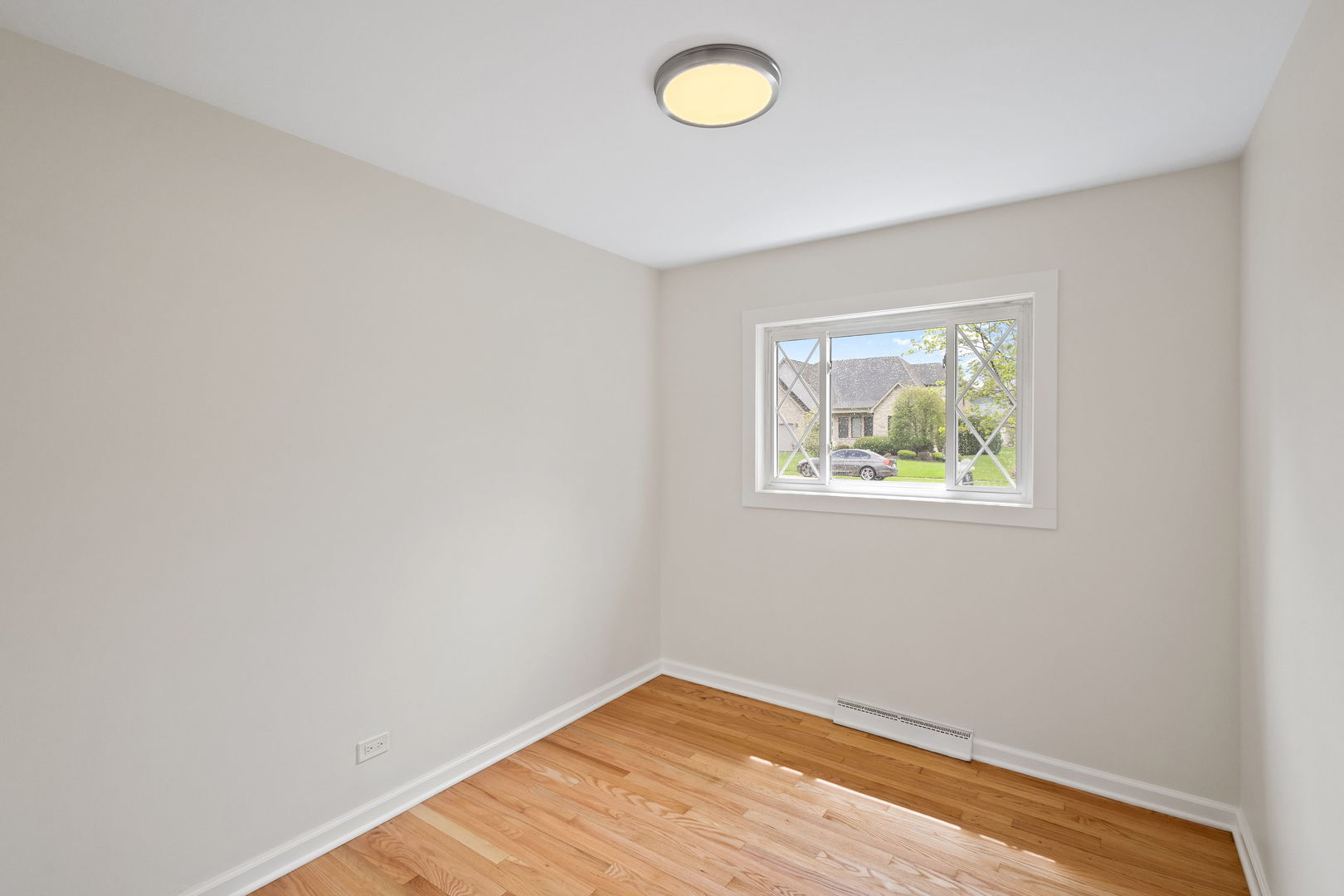 646 68th Street Willowbrook, IL 60527 - Photo 13 of 27 an empty room with a window