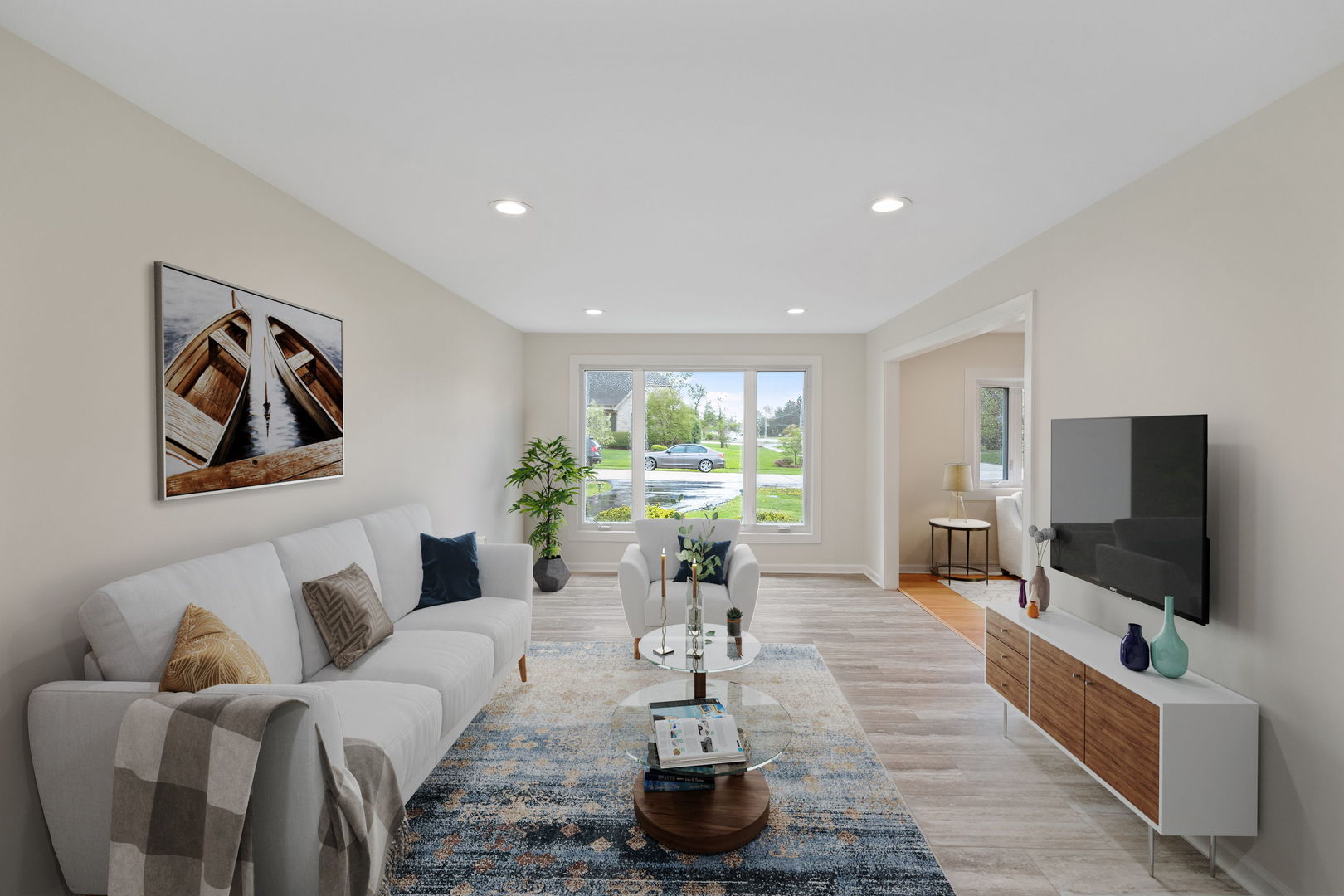 646 68th Street Willowbrook, IL 60527 - Photo 6 of 27 a living room with furniture and a flat screen tv