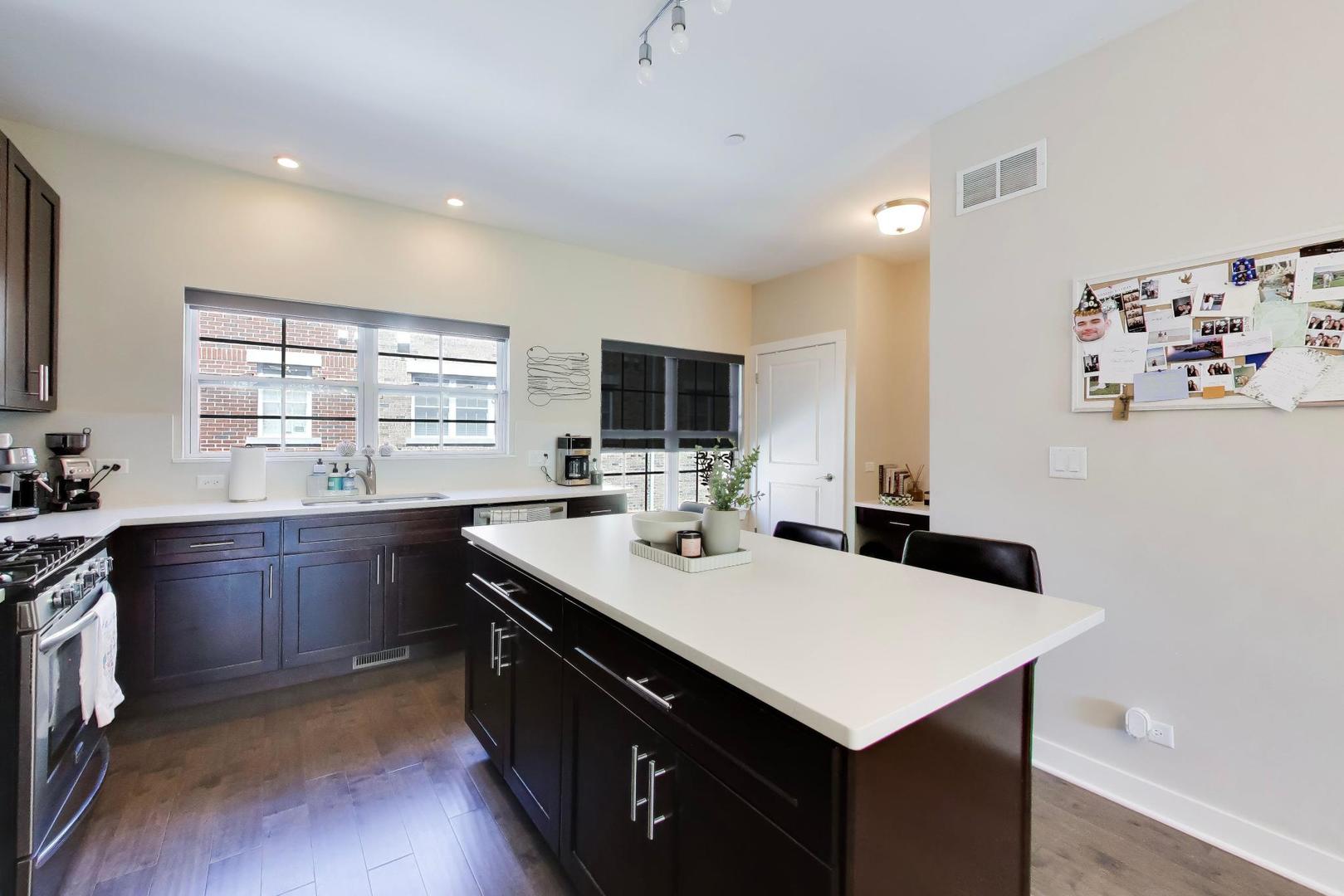 1623 Church Street Evanston, IL 60201 - Photo 12 of 29 a kitchen with a sink a stove and microwave