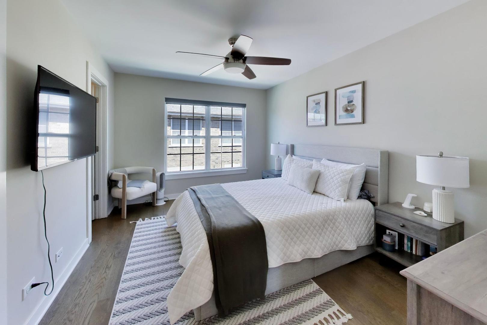 1623 Church Street Evanston, IL 60201 - Photo 14 of 29 a bedroom with a bed and a flat screen tv