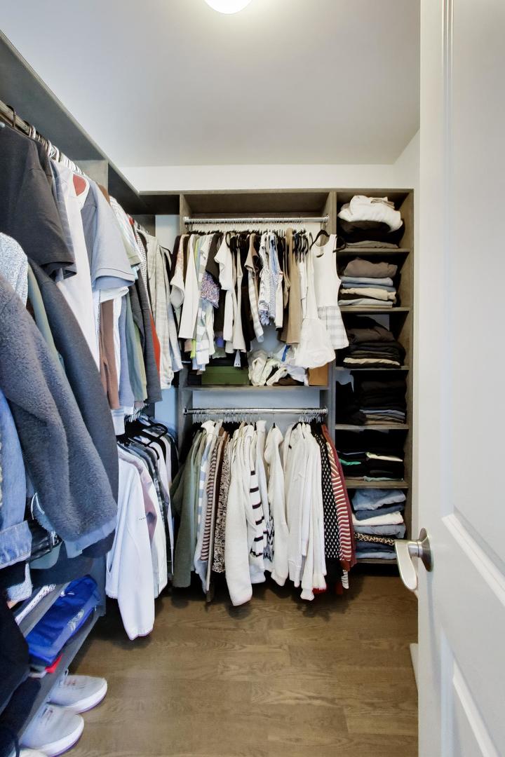 1623 Church Street Evanston, IL 60201 - Photo 19 of 29 a view of walk in closet with clothes and shoes