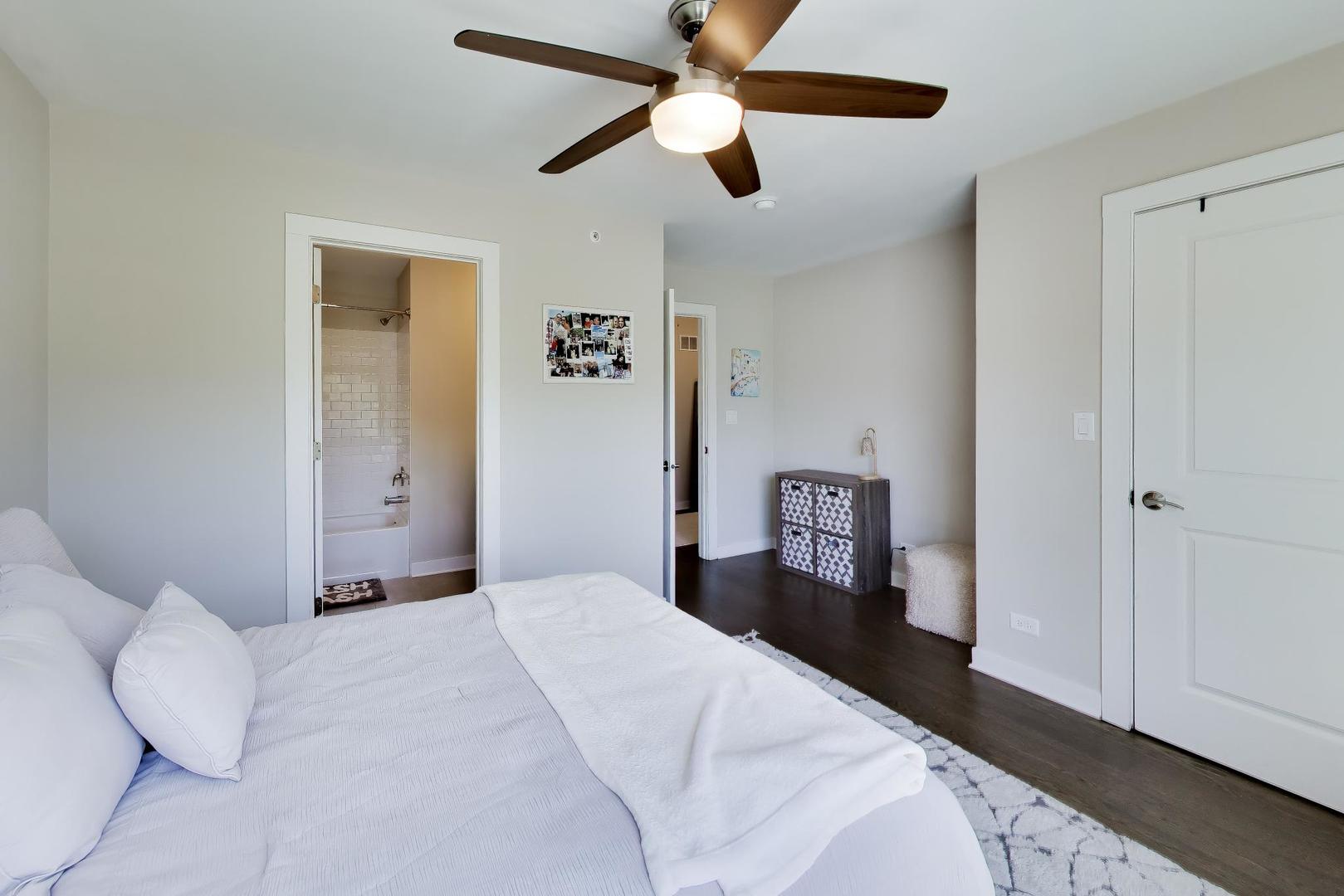 1623 Church Street Evanston, IL 60201 - Photo 21 of 29 a bedroom with a bed and cabinets