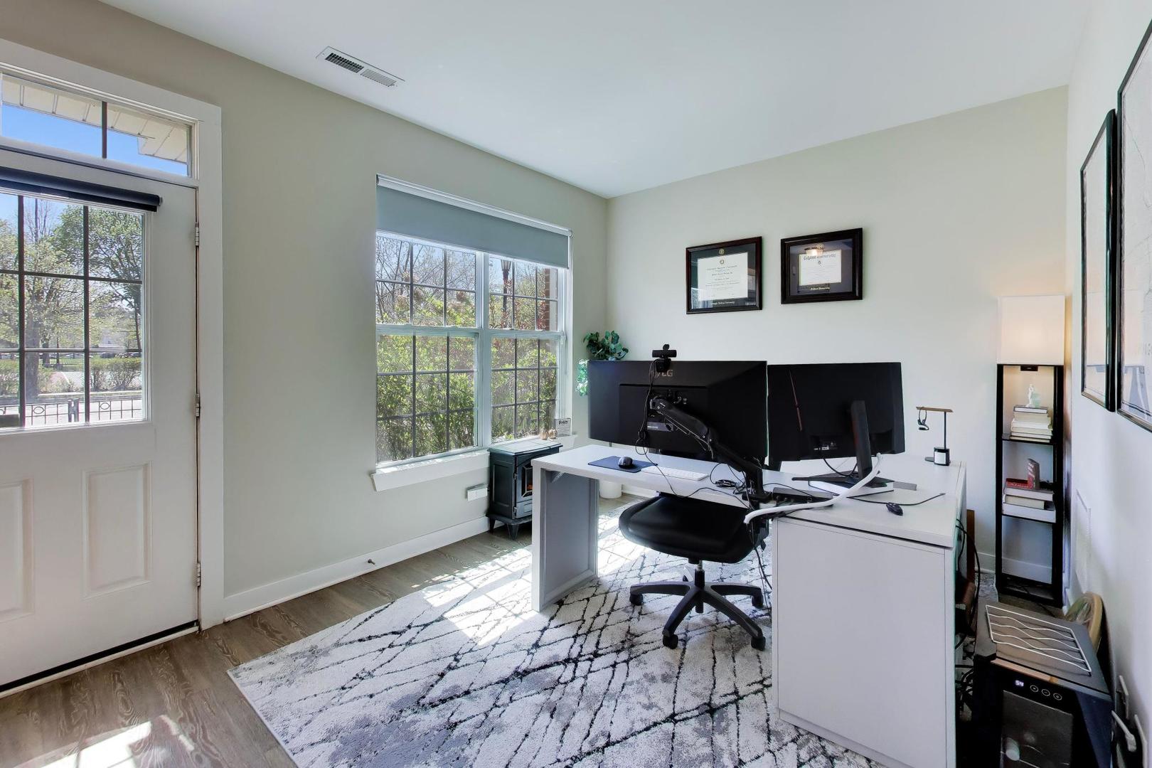 1623 Church Street Evanston, IL 60201 - Photo 4 of 29 a workspace with furniture and a window