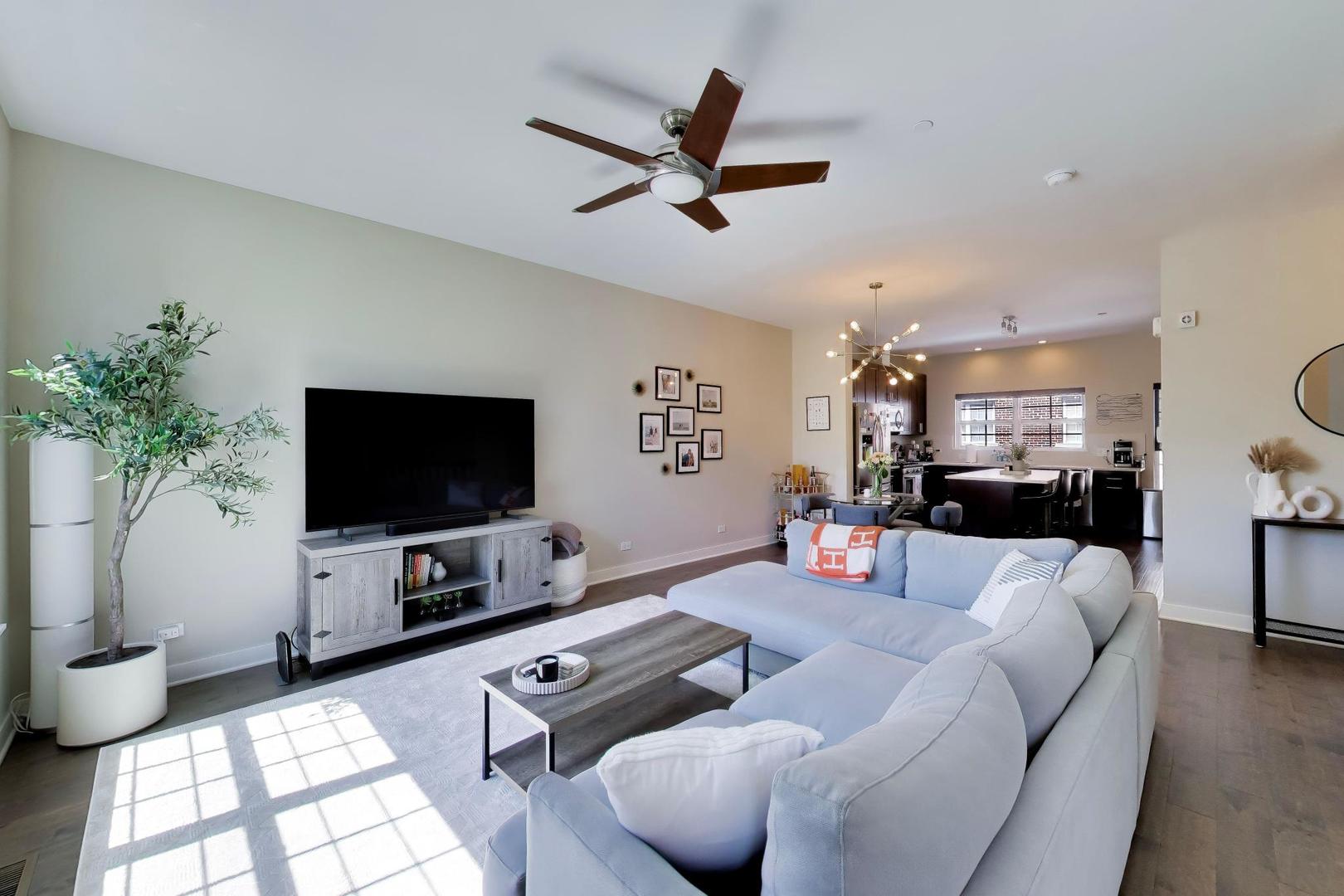 1623 Church Street Evanston, IL 60201 - Photo 7 of 29 a living room with furniture and a flat screen tv