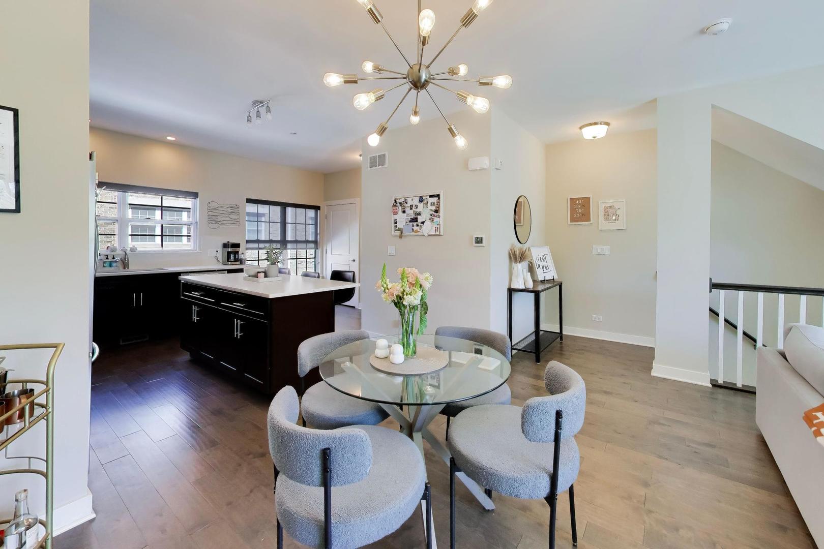 1623 Church Street Evanston, IL 60201 - Photo 9 of 29 a view of a dining room with furniture and a chandelier