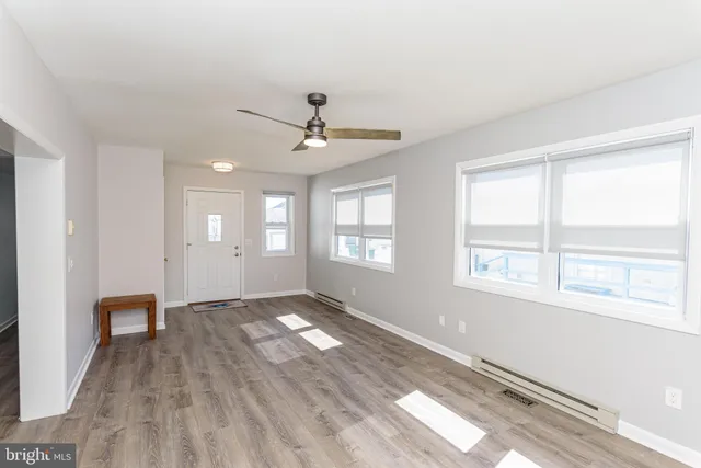 an empty room with wooden floor