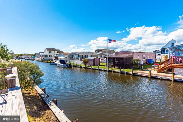 swimming pool view with a lake view