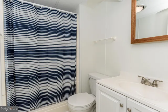 a view of balcony with wooden floor and fence