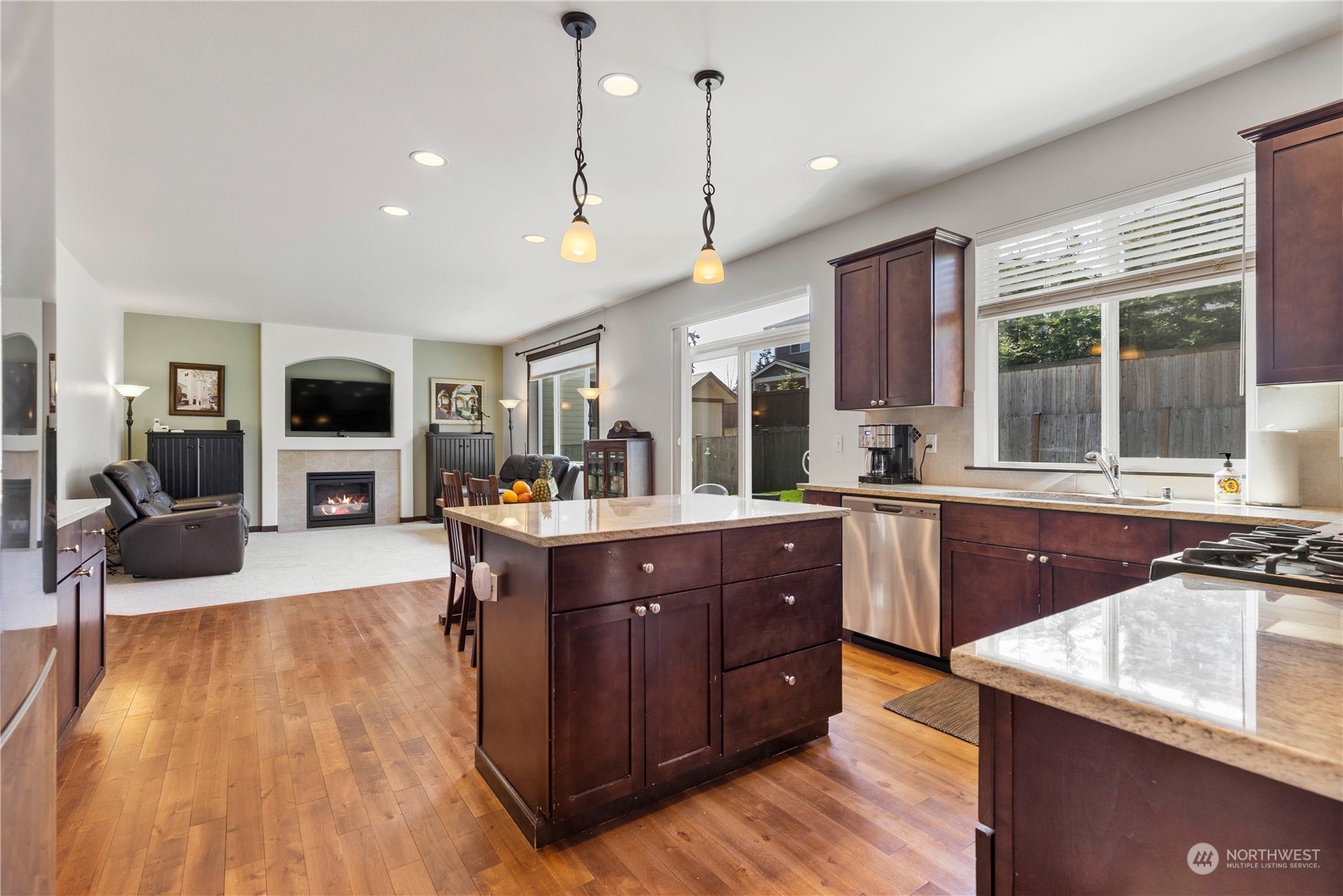 19 216th Street Southwest Bothell, WA 98021 - Photo 8 of 15 a kitchen with a sink stove and wooden floor