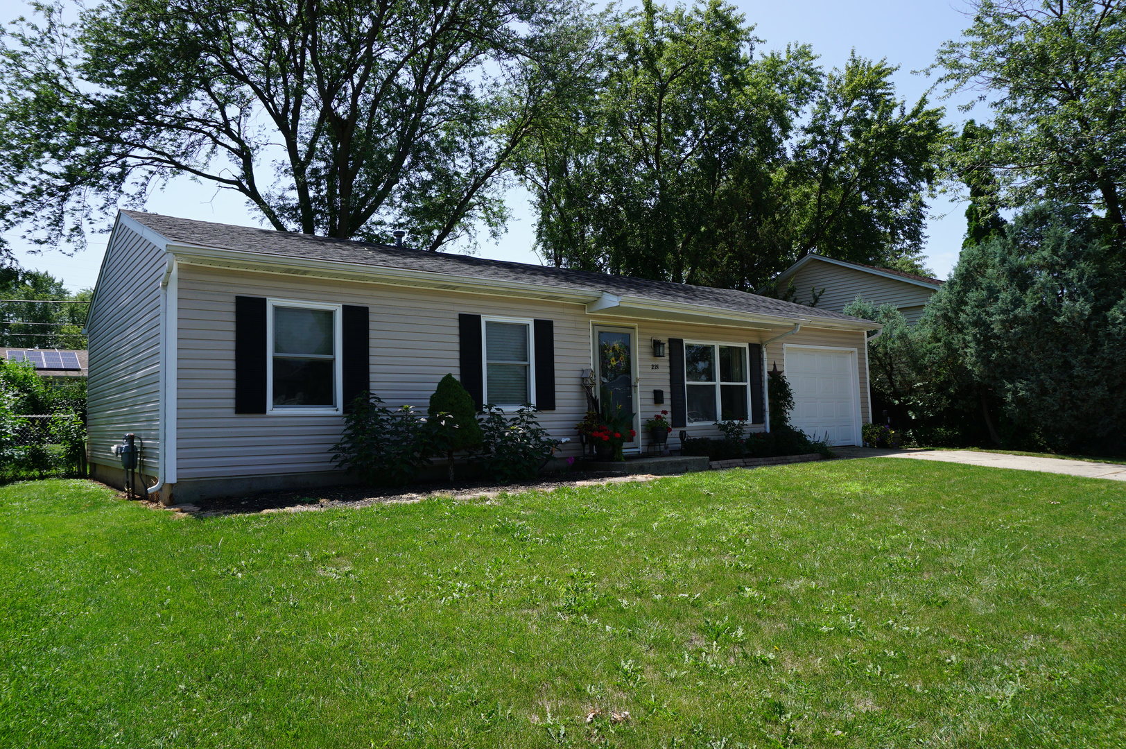 221 Healy Avenue Romeoville, IL 60446 - Photo 1 of 13 a view of a house with a yard and tree s