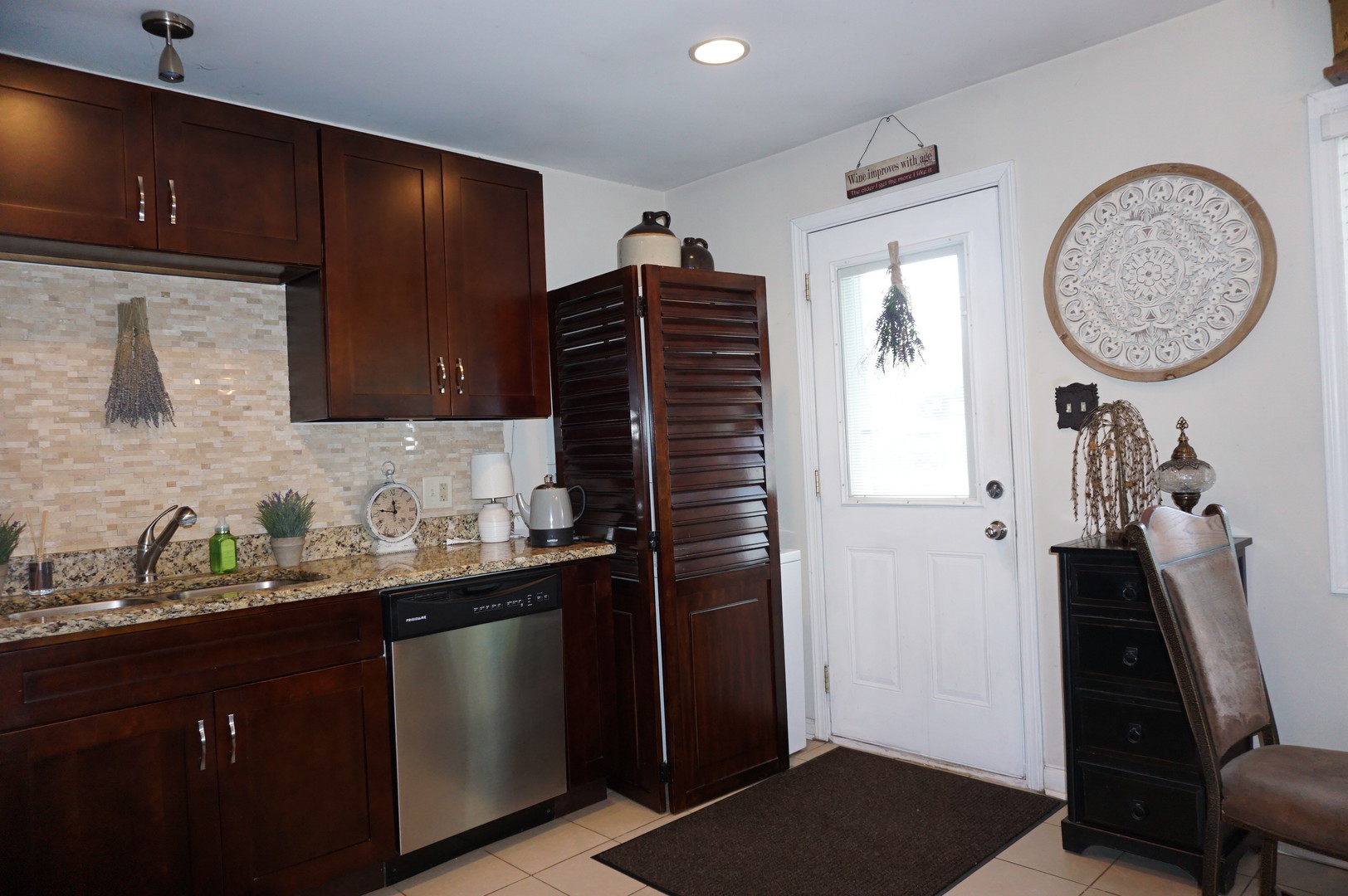221 Healy Avenue Romeoville, IL 60446 - Photo 3 of 13 a kitchen with a sink a refrigerator and a stove