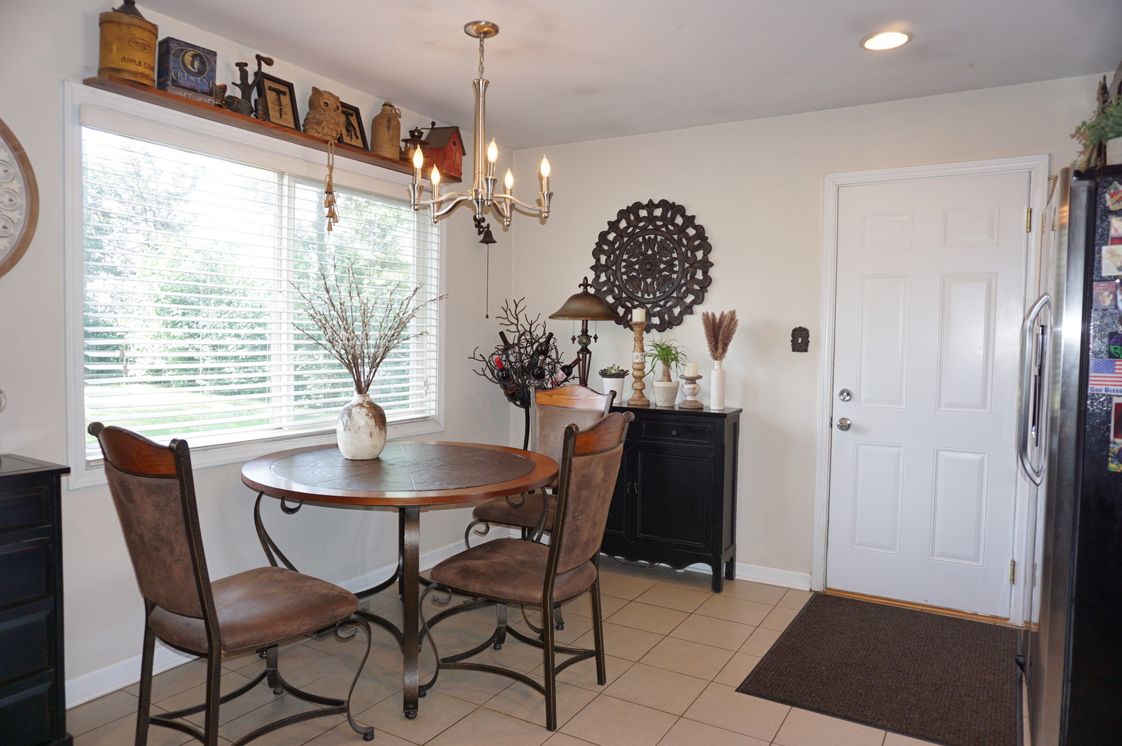221 Healy Avenue Romeoville, IL 60446 - Photo 4 of 13 a dining room with furniture a chandelier and window