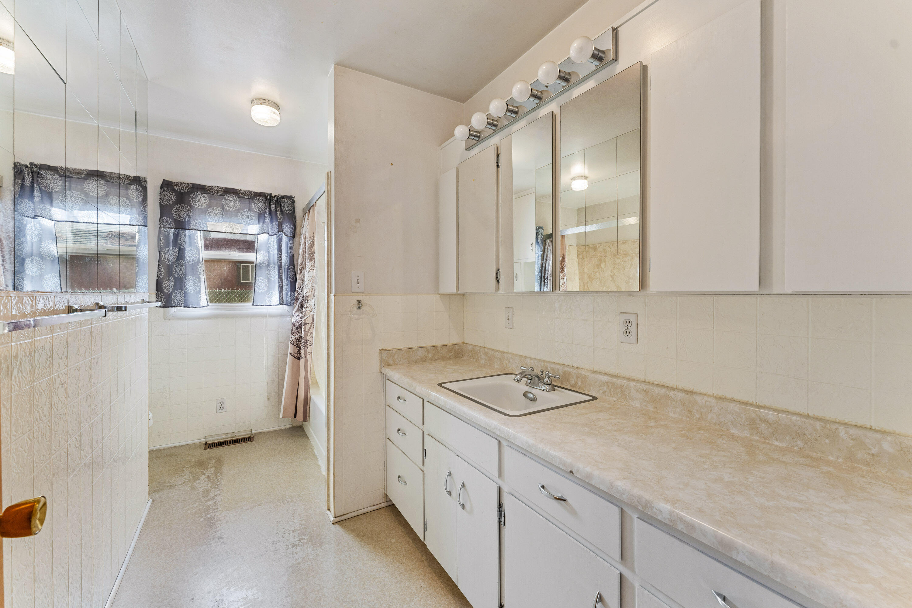 220 South 3rd Street Central Point, OR 97502 - Photo 18 of 29 Main bathroom has long counter and lots of storage