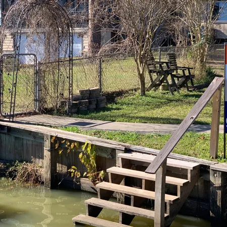a view of swimming pool with a patio and a yard