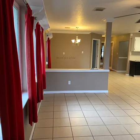 a view of a hallway with a furniture