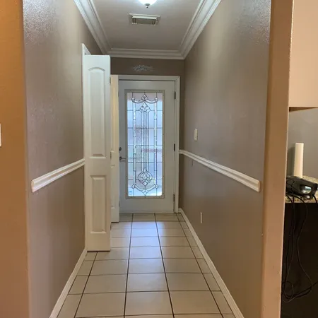 a view of an empty room with a window