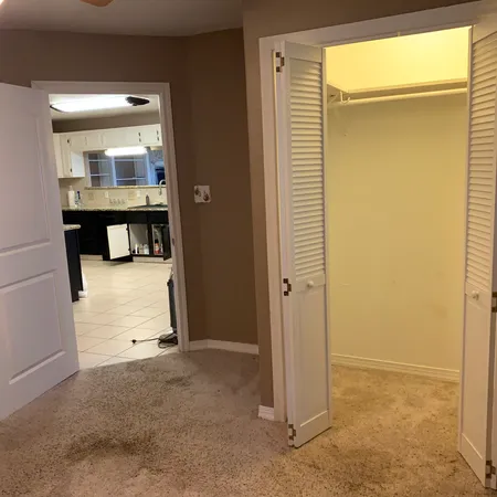 a view of a hallway with seating area