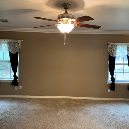 a view of a room with a chandelier