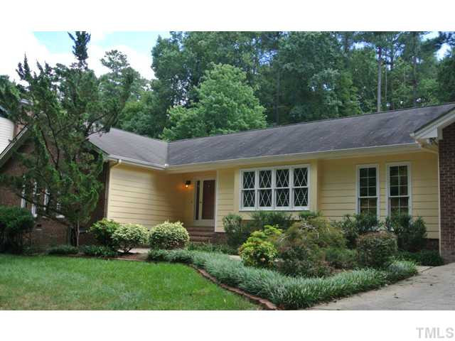 2215 Yorkgate Drive Raleigh, NC 27612 - Photo 2 of 24 The manicured front yard is colorful with shrubs and natural trees. Yard