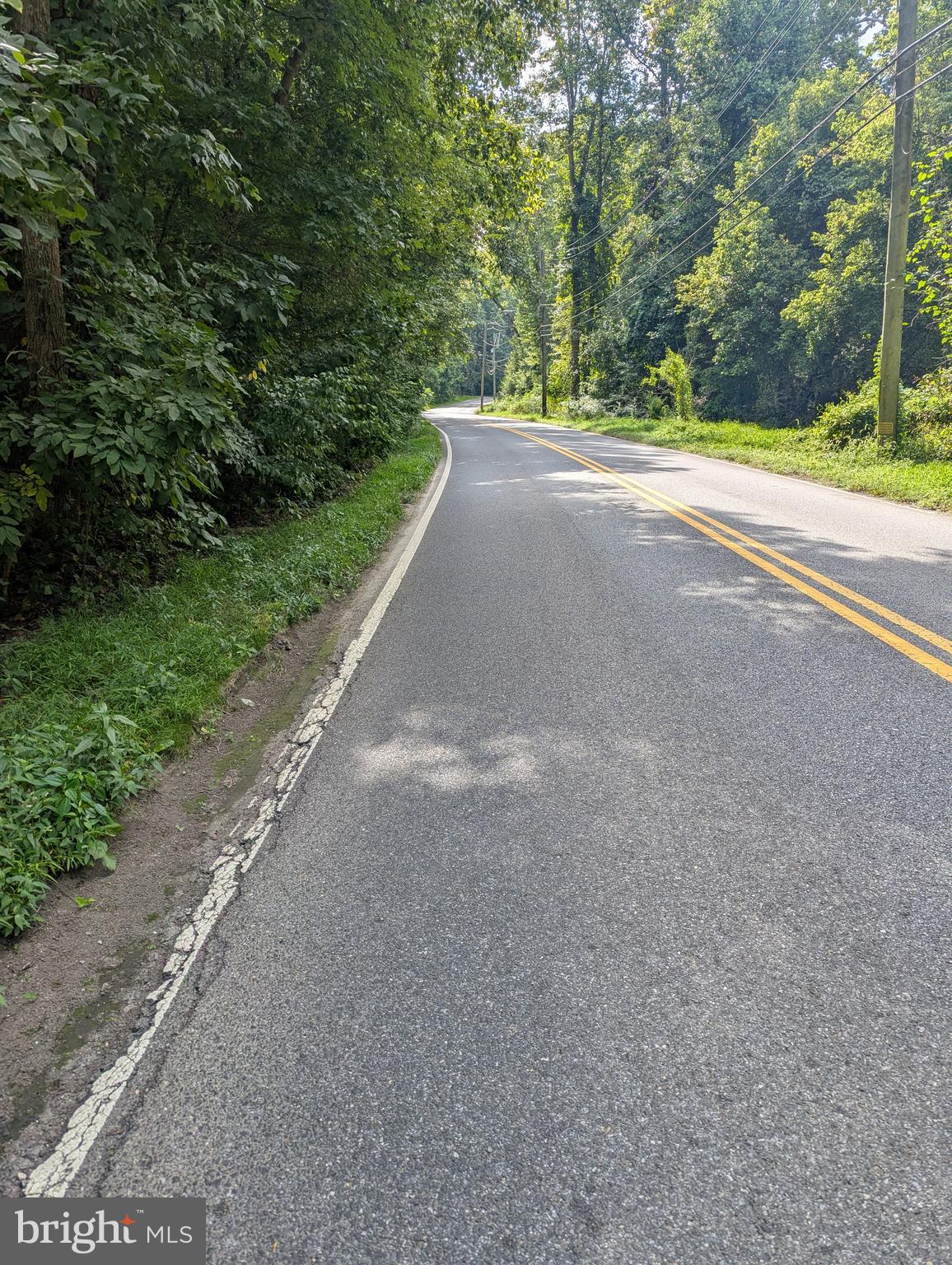 3671 Floral Park Road Brandywine, MD 20613 - Photo 3 of 7 a view of a road with a yard