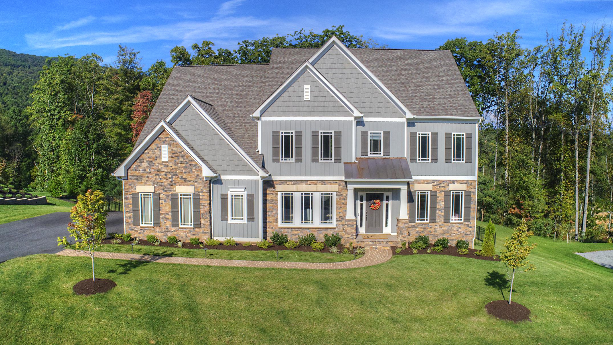 front view of a house with a yard