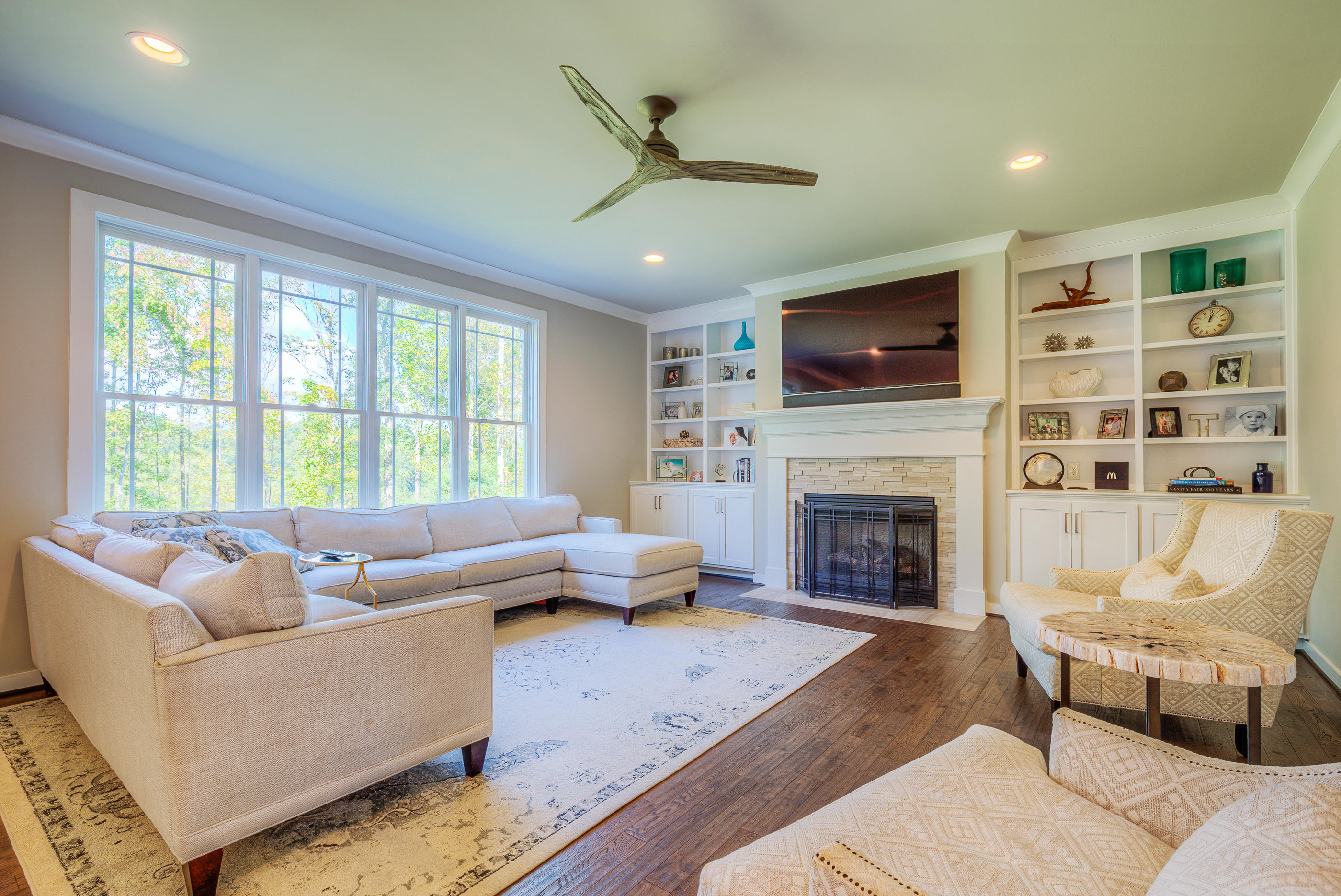 6910 Fairway Ridge Road Salem, VA 24153 - Photo 3 of 46 a living room with furniture a fireplace and a flat screen tv