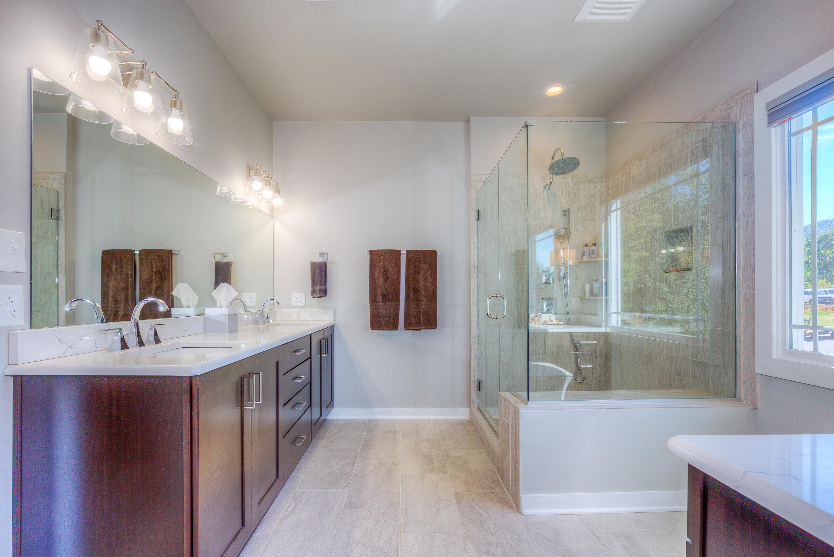 6910 Fairway Ridge Road Salem, VA 24153 - Photo 23 of 46 a spacious bathroom with a sink a large mirror and shower