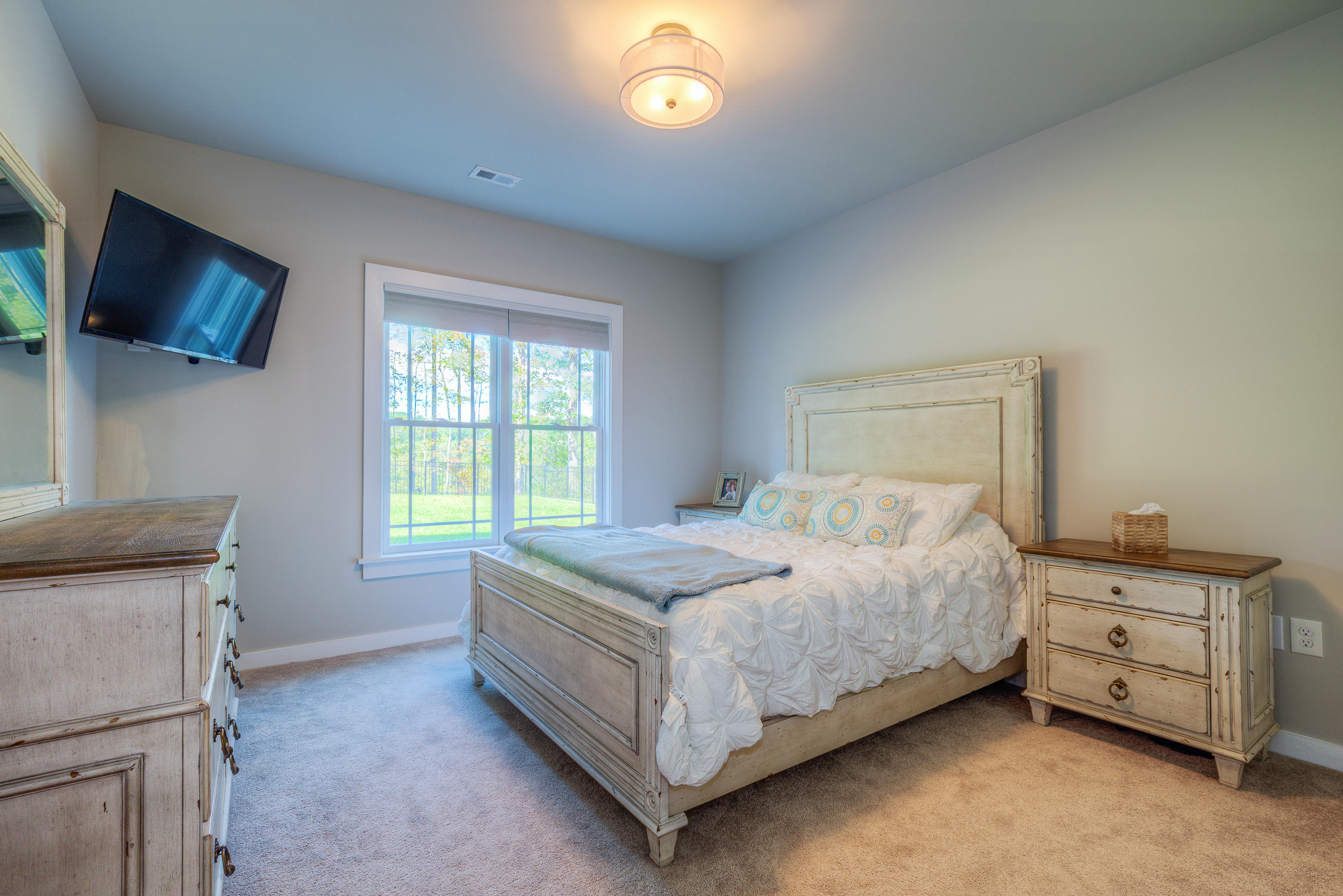 6910 Fairway Ridge Road Salem, VA 24153 - Photo 34 of 46 a bedroom with a bed and a tv on the dresser